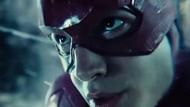 The Flash uses his speed and time-traveling abilities to save the world (Image via Warner Bros)